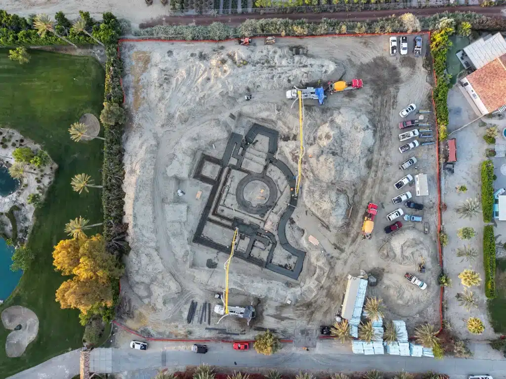 Luxury ICF custom home construction featuring aerial view of curved and circular footing forms in Indio, CA by Tenax Construction