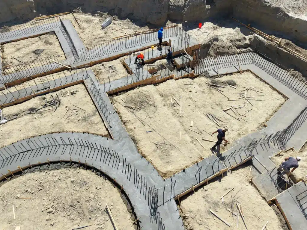 Luxury ICF custom home construction featuring reinforced stepped concrete footings at multiple elevations in Indio, CA by Tenax Construction