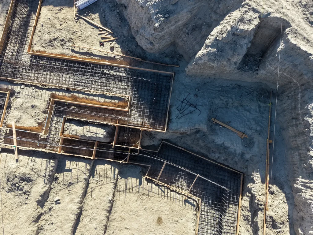 Luxury ICF custom home construction featuring pre-pour electrical conduit coordination through ICF slabs in Indio, CA by Tenax Construction