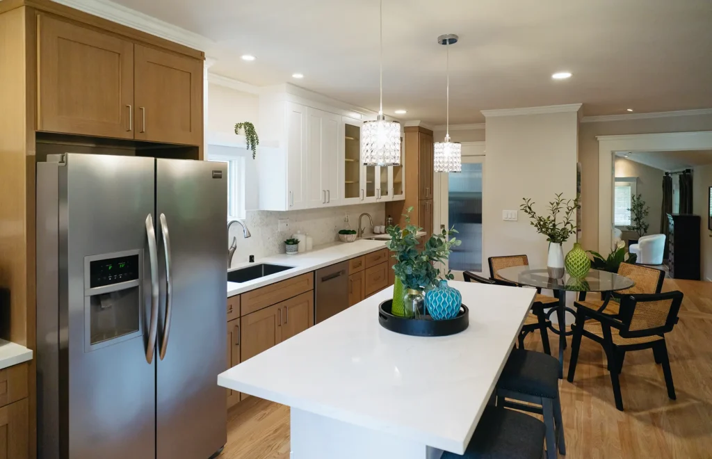 Complete kitchen remodel featuring full appliance installation including range, refrigerator and range hood in Sacramento, CA by Tenax Construction